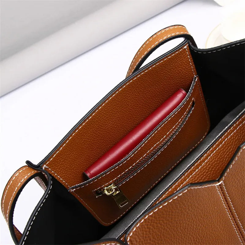 Genuine Leather large capacity 32 x27x12cm  12.2" x  14.6" x 4.75", will take small laptop, tablet and all your essentials.  Eye-Catching range of colours to suit any vibe..